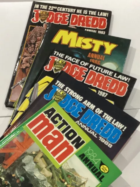 selection of vintage annuals, action man, misty, judge dread