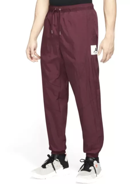 NIKE JORDAN ESSENTIAL Statement Woven Maroon Track Pants Mens