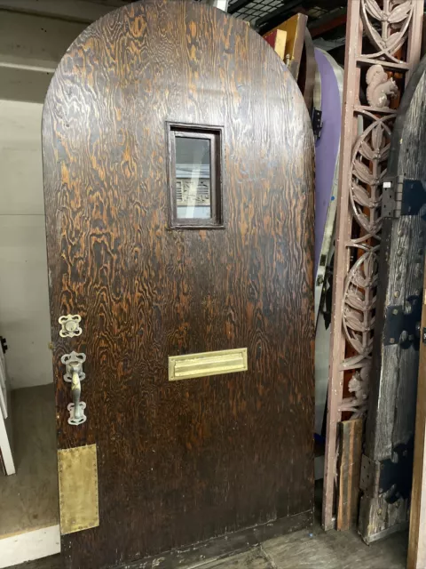 Arched Spanish Revival front door tiger oak with the original hardware