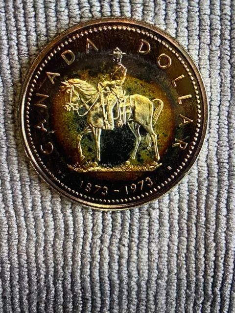 1973 Canada Silver Dollar RAINBOW TONED -& CAMEO - RCMP  UNCIRCULATED SPECIMEN