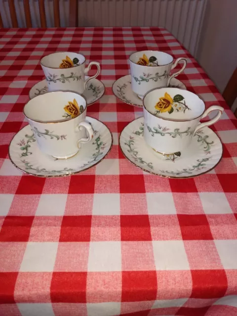 Royal Stafford Coffee cups and saucers with a yellow rose inside. good condition