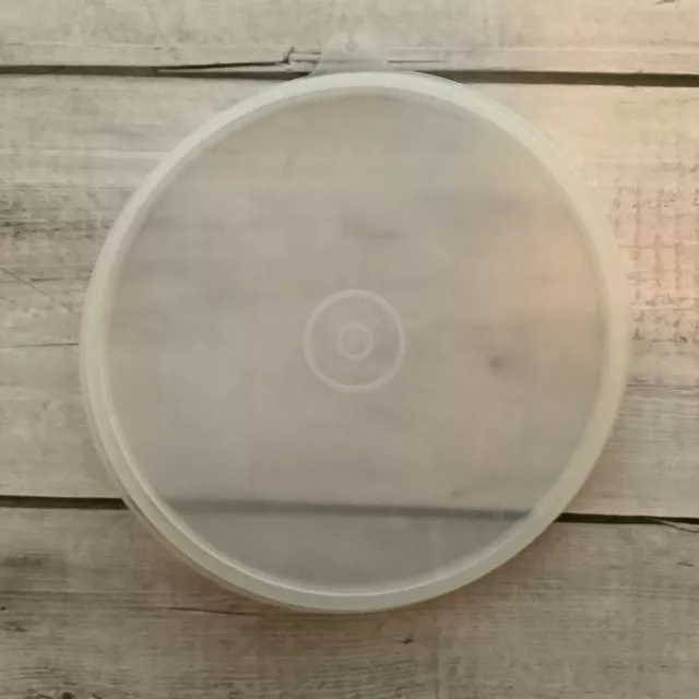 https://www.picclickimg.com/McgAAOSwp2Fj5ckt/Tupperware-Round-Lid-Seal-227-8-Clear-with-Tab.webp