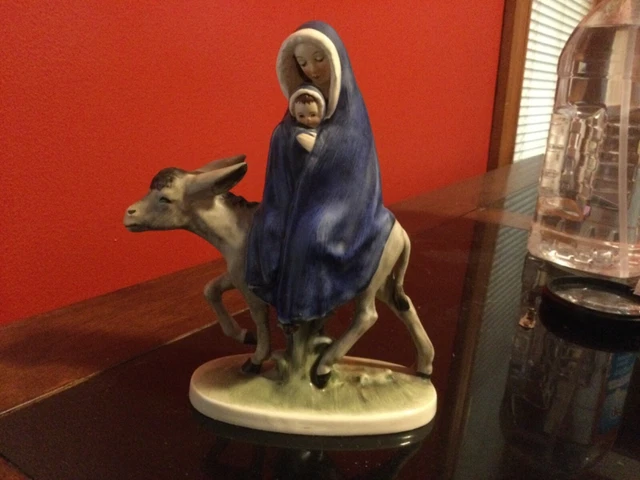 Figurine of Madonna and child on a mule. Made in W.Germany.in great condition.