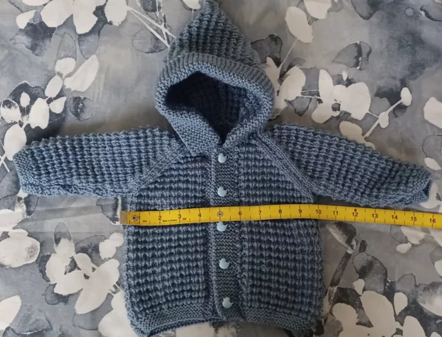 Hand knitted baby boy's denim blue hooded jacket