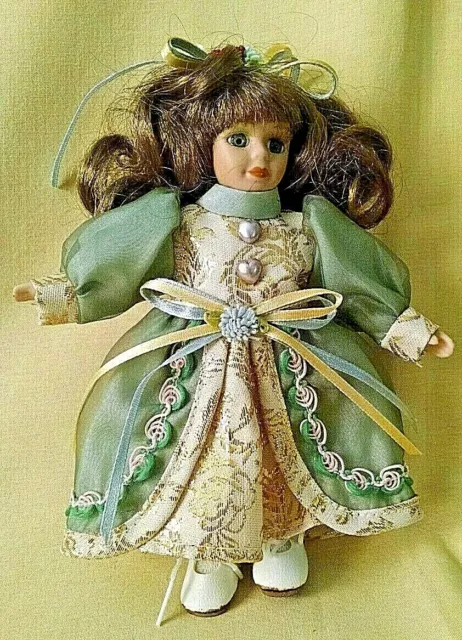 Porcelain Doll New 7" Brunette Green Dress Pantaloons White Shoes Unmarked.