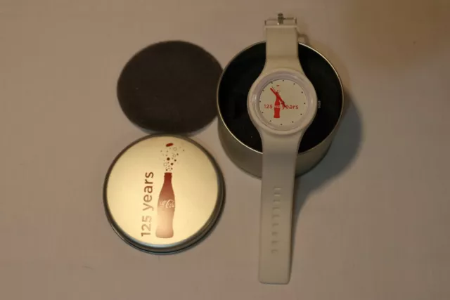 Coca Cola 125 year anniversary watch and tin container.