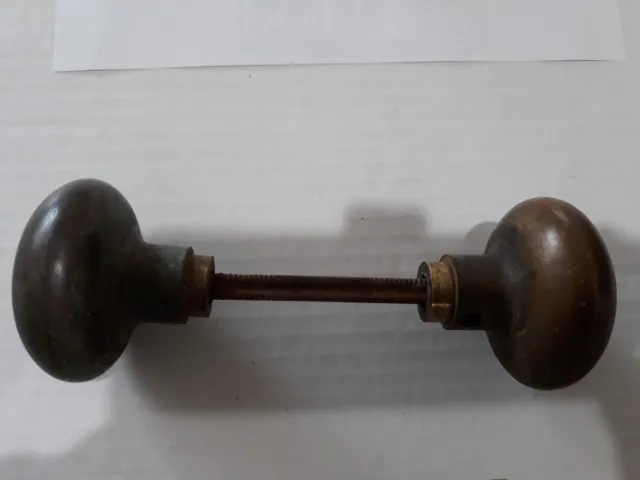 Antique Victorian round doorknob pair with threaded spindle