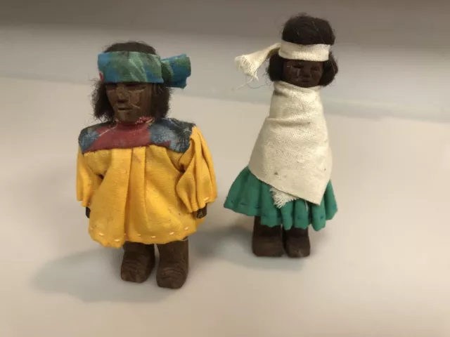 A Pair Of Hand Carved Wood American Indian Figures Dressed In Clothes