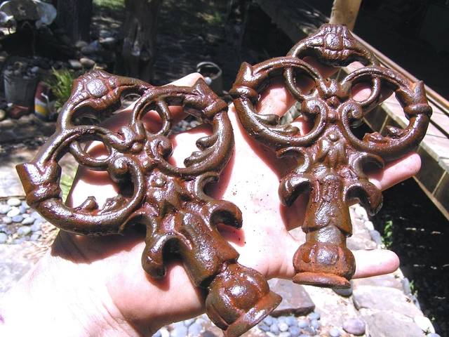 TWO solid cast iron key style finials sealed rust finish