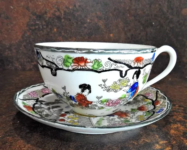 Famille Rose Chinese hand painted cup and saucer