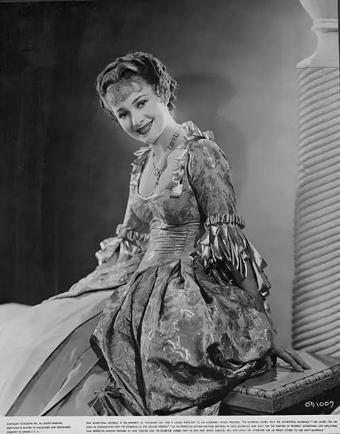 actress Olivia de Havilland wearing an 18th century formal gown - 1930 Old Photo