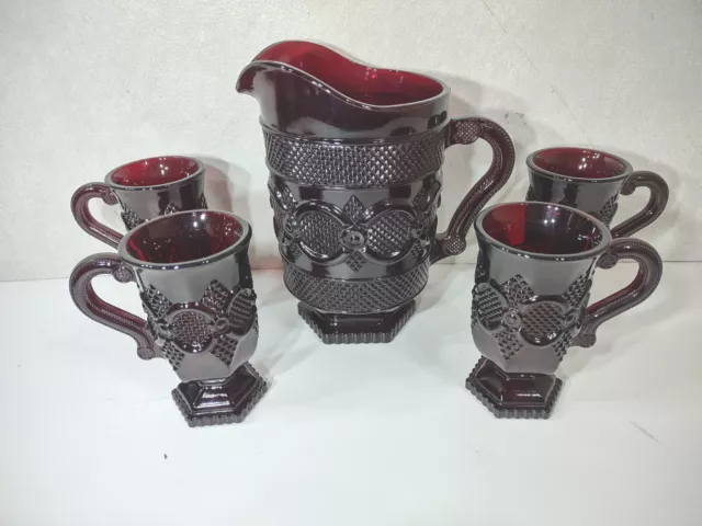 Avon 1876 Cape Cod Ruby Red 46 oz Water Pitcher Footed 8” with 4 Footed Glasses