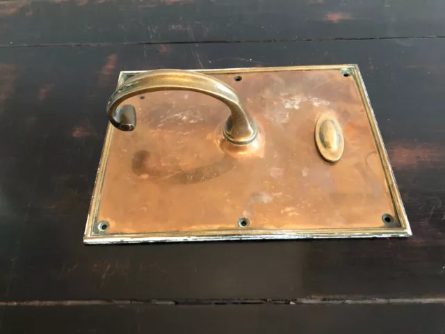 A Pair Of Hand Crafted Solid Brass Door Handles On Back Plates With Escutcheons