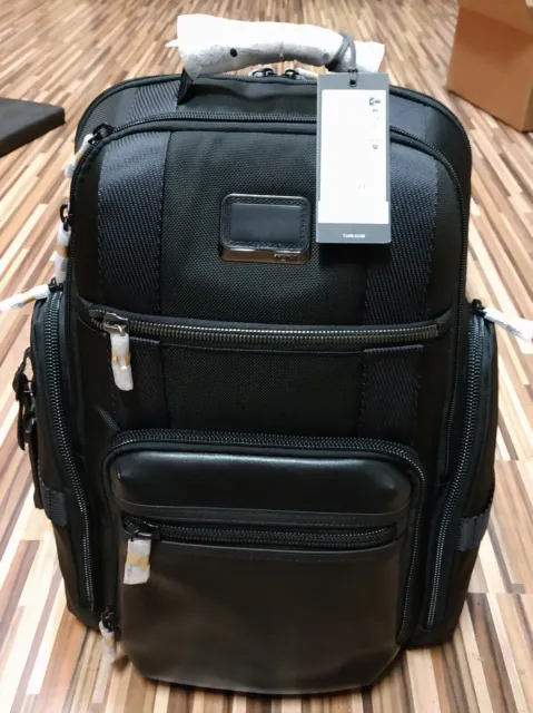 Tumi Sheppard Deluxe brief pack. 95% Ballistic nylon & 5% cowhide leather.