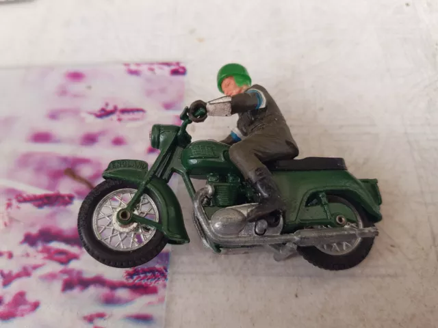 altes Britains Motorrad mit Fahrerfigur grün