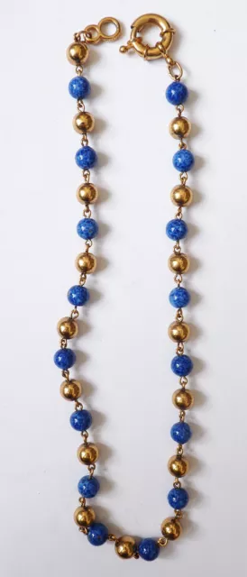 Collier avec des perles bleue et dorée signé AGATHA