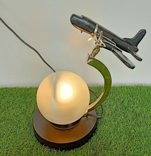 Antikschwarze Flugzeug-Tischlampe mit dekorativer Glaskugel-Tischplatte