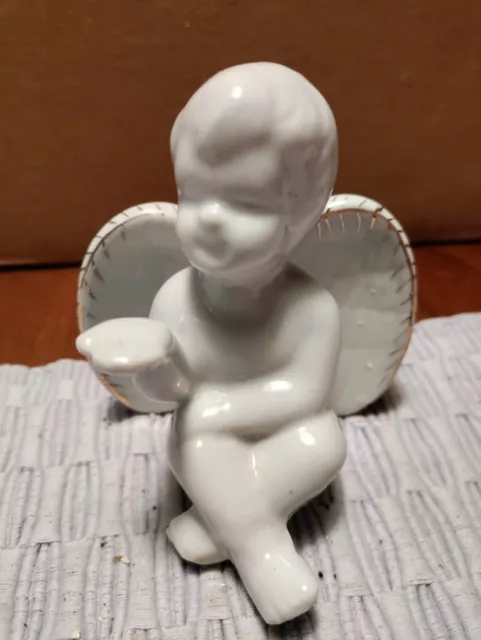 White Ceramic Siting Angel Cherub blowing a kiss