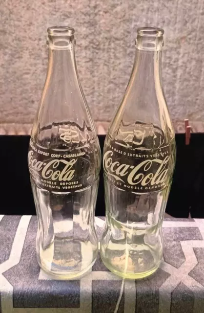 tow vintage Coca-Cola bottles of 77 CL arabic writting old moroco and one line