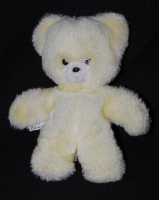 Peluche doudou ours BOULGOM jaune yeux durs langue rose grelot 22 cm TTBE