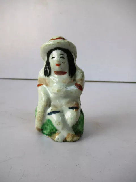 Antique Porcelain Figurine Girl Hat With Ribbon Sitting On Rock Holding Food"F81