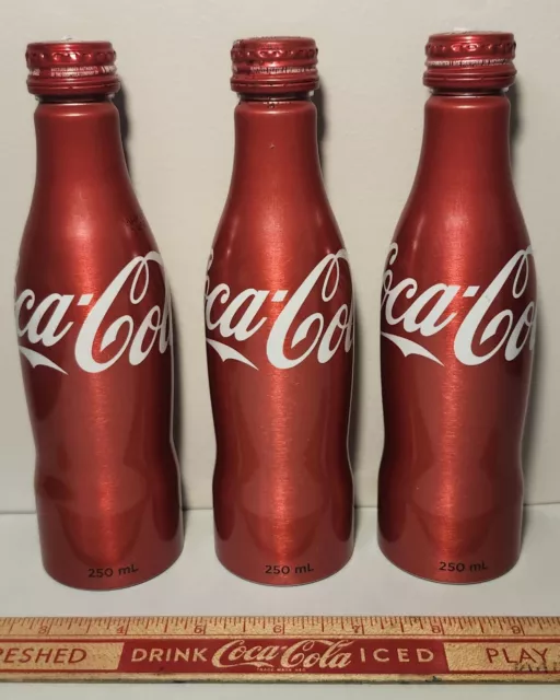 3x Coca-Cola 250ml Full Unopened Collectible Red Aluminum Bottles