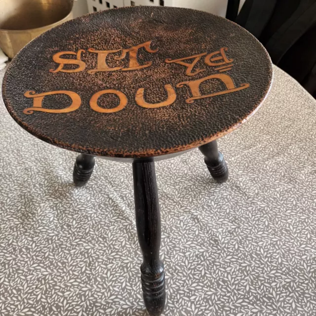 Art and Crafts 3 legged stool. Signed 1899. Hand carved with motto Sit Ye Doun.