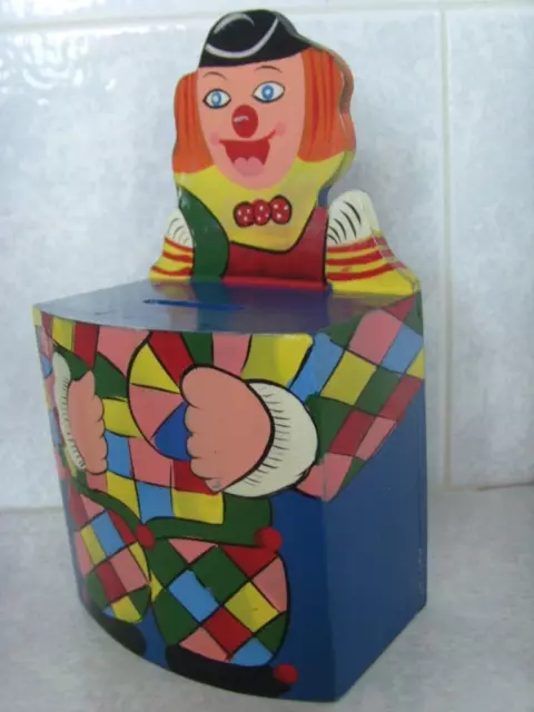 128- Jolie petite tirelire clown en bois multicolore