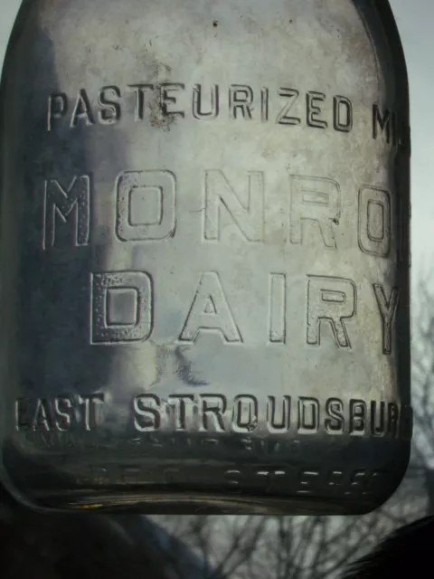 Clear embossed 1 qt. Monroe Dairy milk bottle East Stroudsburg, Pa.