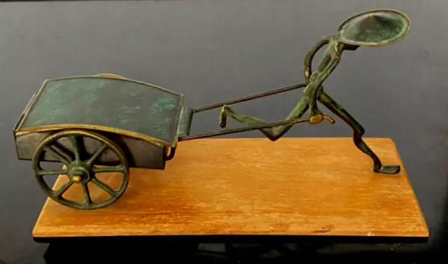 Vintage HAKULI Israel Bronze  Man Pulling Lidded Cart Wood Base Foil Label