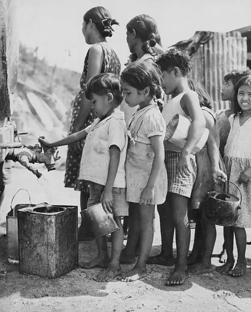 INDIGENOUS GUAM CHILDREN waiting for fresh water supplies from US Old ...