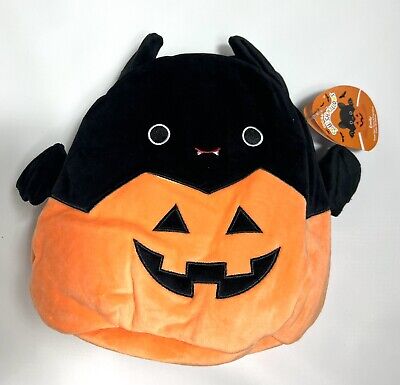 emily in a pumpkin squishmallow