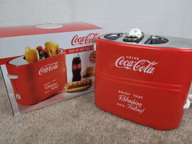 https://www.picclickimg.com/NYUAAOSwKidi-Xg5/Nostalgia-HDT600COKE-Coca-Cola-Pop-Up-Hot-Dog-Toaster.webp