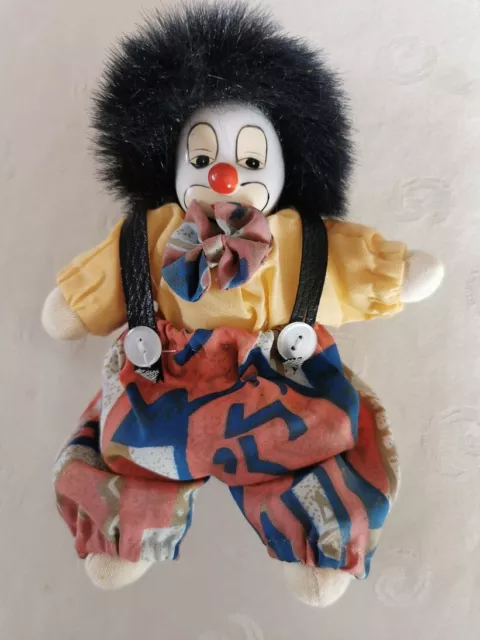 Clown mit Porzellankopf