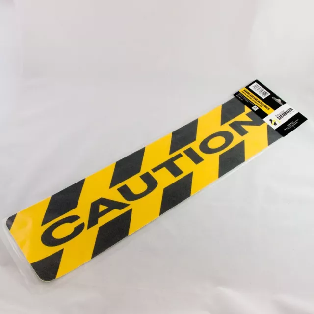 Pegatina antideslizante amarillo y negra cebrada con escrita "CAUTION"
