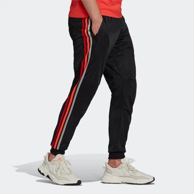 black adidas sweatpants with red stripes