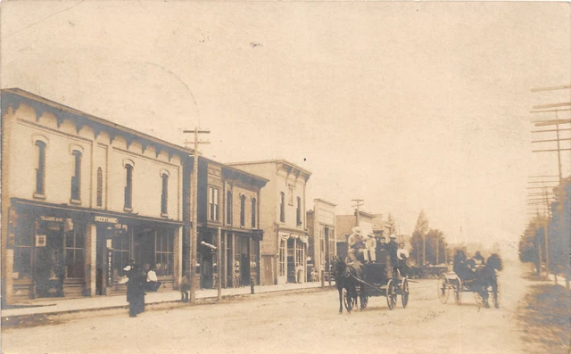 H19/ White Cloud Michigan RPPC Postcard c1910 Main Street Stores 65