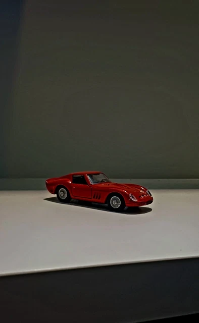 An Old Vintage Red Ferrari 250 GTO Car On A Race Track With Blurred Background 2jknrry
