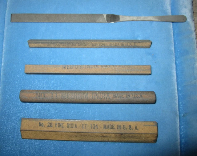 Lot of 4 Norton aluminum oxide India sharpening stones & 1 small metal file
