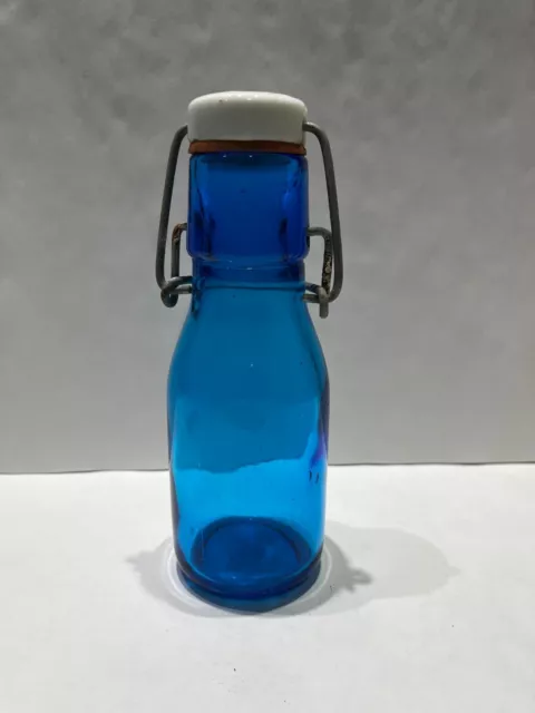 Vintage blue colored bottle with top swing wire porcelain lid