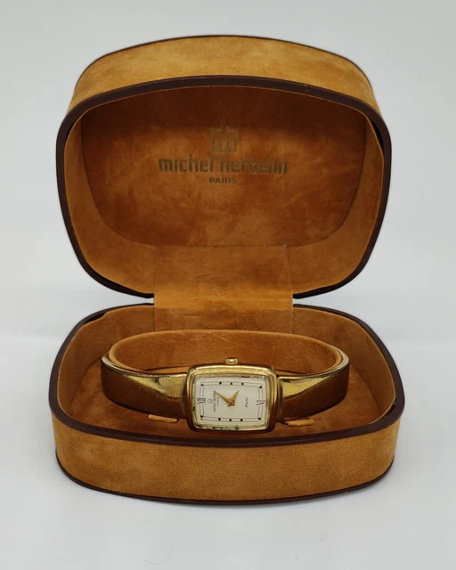 Montre Michel Herbelin femme bracelet semi-rigide en métal doré modèle 7855 Montre Michel Herbelin femme bracelet semi-rigide en métal doré modèle 7855