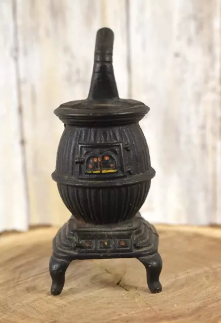 https://www.picclickimg.com/NuUAAOSwOIpeH98p/Vintage-Handpainted-Miniature-Cast-Iron-Pot-Belly-Stove.webp
