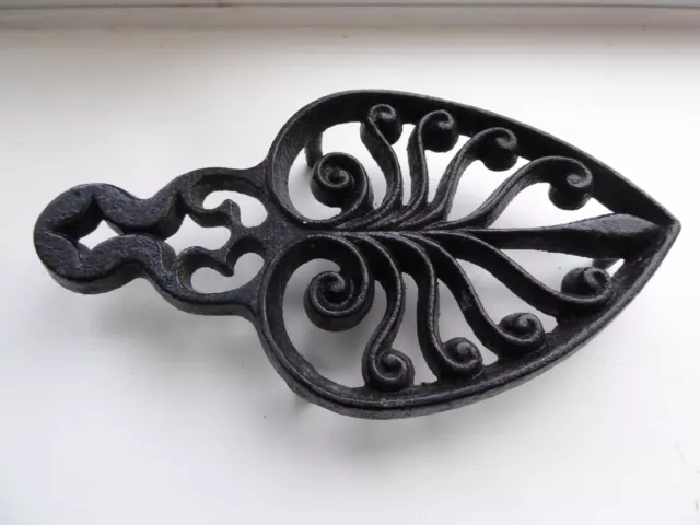 Antique cast iron trivet for flat or sad iron