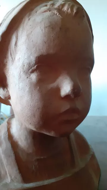 Scultura tedesca in terracotta. Firmata.Busto di bambino.