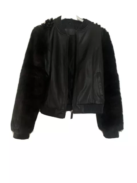 Giacca verde militare sale con maniche in pelle