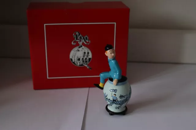 Tintin sortant de la potiche pixi lotus bleu tim struppi kuifje bienlein