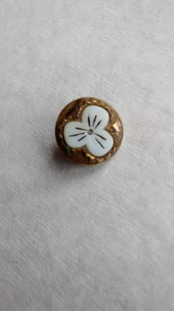 Très joli bouton ancien de 15 x 0.9 mm en bakélite laiton ou bronze
