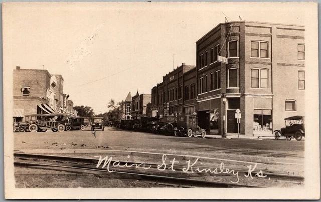 1920s KINSLEY, Kansas Real Photo RPPC Postcard MAIN STREET Downtown Scene Unused