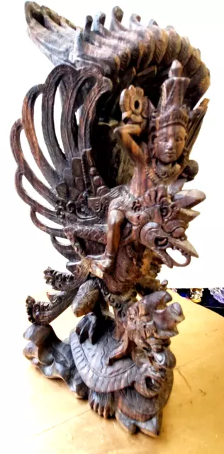 Antique Balinese Carving. Lord Vishnu riding Vahana Garuda on back of the Turtle