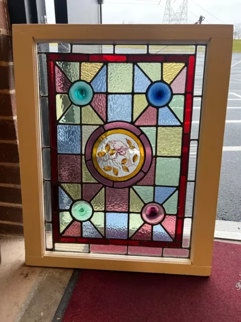 1890s Queen Anne style stained glass window featuring painted bird